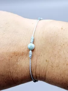 Dětský provázkový náramek Larimar kulička v modré s uzlíky (14 - 24,5 cm)